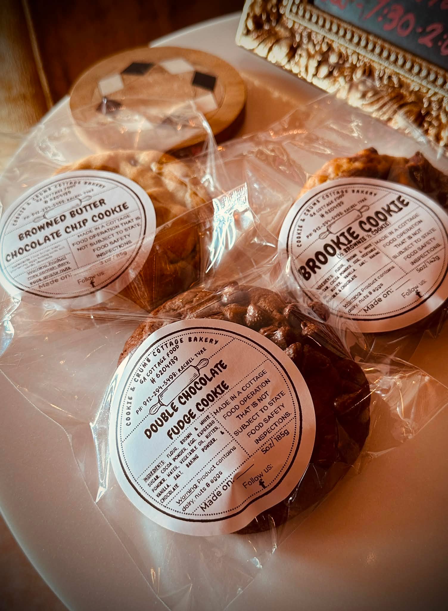 Individually wrapped Cookie & Crumb cookies with cottage food labels, ready for pickup
